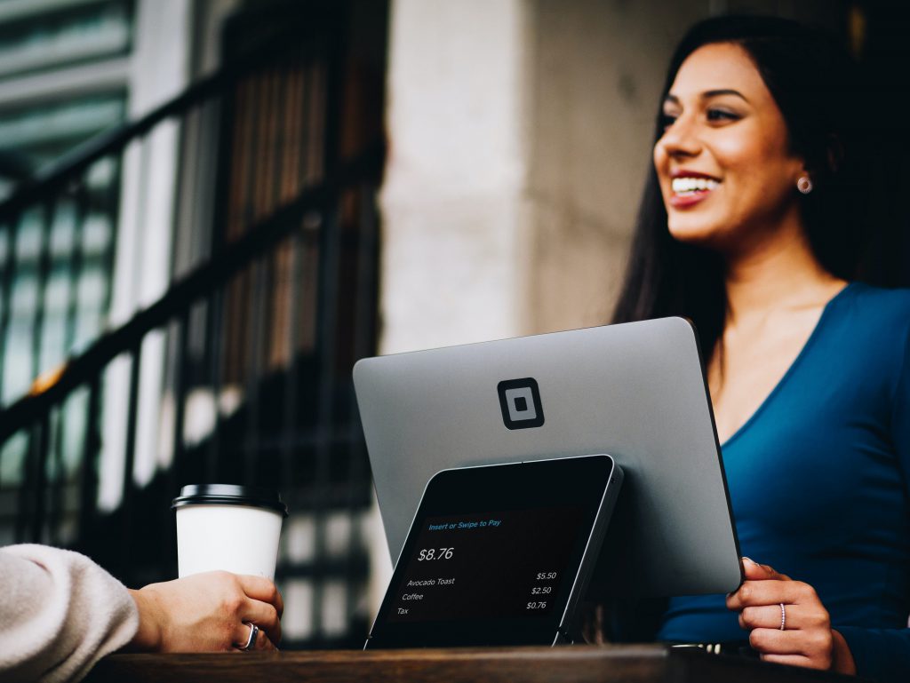 Woman use POS System in Coffee shop, ERP(Enterprise Resource Planning) System in Singapore